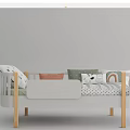 Kids Bed With Wooden Legs Safety Rail Colorful Pillows And Rainbow Polka Dot Sheets