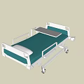 Medical Bed With Green Mattress White Metal Frame Side Rails Wheels And Foldable Table