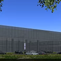 Modern Glass Curtain Wall Office Building With Parking Area Greenery And Blue Sky