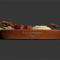 Fried Chicken Leg with Rice Potato Chunks Vegetables and Red Sauce Served on Orange Plate