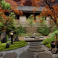 Traditional Courtyard Garden With Autumn Trees Greenery Walls Stone Pathways And Lanterns