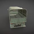 Green Military Truck With Canvas Covered Cargo Bed And Six Wheels