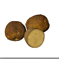 Fresh Yellow Fruit with Brown Spots Whole and Sliced on White Surface