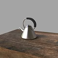 Elegant Stainless Steel Teapot With Black Handle On Rustic Wooden Table