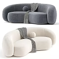 Curved Beige And Brown Sofa With Gray Throw Blanket And Round Pillow