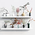 Modern Assorted Vases With Decorative Plants Arranged On White Wall Shelves 3d model