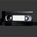 Open Black VHS Video Cassette Tapes With Plastic Cases On Dark Background