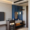 Hotel Guest Room With Blue Tiled Wall Round Mirror Vanity TV And Minibar
