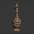 Intricate Patterned Metallic Household Item With Spout And Handle Design