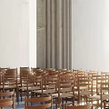 Wooden Chairs In Religious Gathering Place With White Walls Curtains And Natural Light