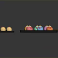Colorful Animal Shaped Snacks Including Chicken and Octopus on Black Trays with Chopsticks