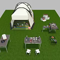 White Camping Tent On Green Grass With Tables Chairs Dinnerware And Food