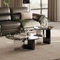 Two Coffee Tables With Black Leather Sofa Green Plant And Books In Living Room
