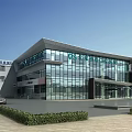 Modern Hospital Building Exterior Design With Glass Curtain Walls Main Entrance And Landscaping