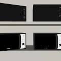 Sharp Brand Black And Silver Microwaves As Kitchen Appliances On Shelves