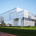 Modern Glass Facade Office Building With Contemporary Design Green Lawns And Sunlit Exterior
