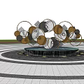 Modern Metal Sculpture With Circular Geometric Shapes In Outdoor Plaza With Fountain And Trees