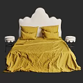Double Bed With Yellow Bed Sheets White Headboard And Small Round Stool