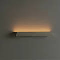 Modern Minimalist Long Rectangular Wall Sconce With Warm Ambient Light Mounted On Gray Wall