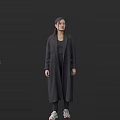 Woman Wearing Long Dark Gray Coat With Black Top And Necklace On Dark Background