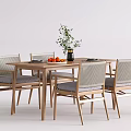 Wooden Dining Table With Four Chairs Plant In Vase And Oranges On Tabletop