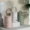 Pastel Pink White And Green Daily Use Humidifiers On Marble Countertop With Striped Wall