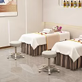 Comfortable Massage Beds With White Sheets Brown Skirts Towels And Purple Flowers In SPA Room