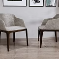 Two Light Gray Upholstered Accent Chairs with Armrests and Dark Wooden Legs