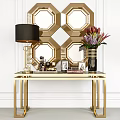 Gold Console Table With Black Lampshade Lamp Flower Vase Photo Frames And Geometric Mirror Wall