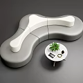 Modern Abstract Shape Sofa In Gray White Leather Upholstery With Side Table And Green Plant