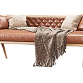 Tufted Brown Leather Sectional Sofa With Wooden Legs Decorative Pillows and Throw Blanket