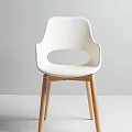 Modern White Leisure Chair With Plastic Back Wooden Legs And Round Cutout Design