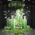 Stunning Art Installation With Green Transparent Columns Fresh Flowers Hanging Butterflies And Hanging Greenery
