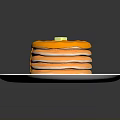 Stacked Pancakes on a White Plate Topped with Yellow Syrup and Butter