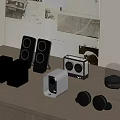 Various Audio Devices With Different Designs Arranged On Wooden Table And Decorative Wall Art Background