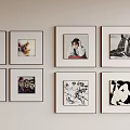 Multiple Photo Frames On Wall Displaying Various Artworks And Decor