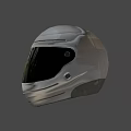 Gray Helmet on Mountain Road with Blue Sky and Reddish Brown Mountains