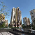Modern High Rise Residential Building With Glass Brick Facade Greenery And People Walking