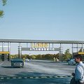 Modern Entrance Gate of Traffic Management Command Center with Vehicles Pedestrians and Trees