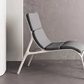Modern Gray Lounge Chair With Metal Frame In Minimalist Interior Setting