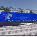 Marathon Event Venue With Blue Backdrop Stage And White Seats