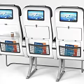Public Chairs With Three in a Row Gray Seats White Headrests Metal Frames and Armrests