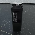 Black Spider Progressional Shaker Cup for Fitness Workout and Protein Mixing on Speckled Black Floor