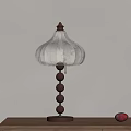 Wooden Table Lamp With Beige Patterned Shade And Ball Pillar On Desk With Decorative Items