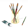 Colorful Paintbrushes In Transparent Cup With Paint Tube For Daily Art Supplies