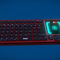 Red Backlit Computer Keyboard With Green Glowing Area and Standard Key Layout