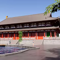 Ancient Chinese Architecture With Curved Roof Red Walls Green Doors Stone Steps And Pond