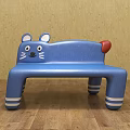 Cat Shaped Blue Public Bench With Ears Eyes Whiskers Red Tail And White Striped Legs