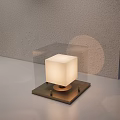 Square Table Lamp With White Lampshade Dark Base On Light Colored Tabletop Gray Wall