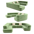 Modern Green Curved Two Seater Sofa With Checkered Pillows And Velvet Upholstery